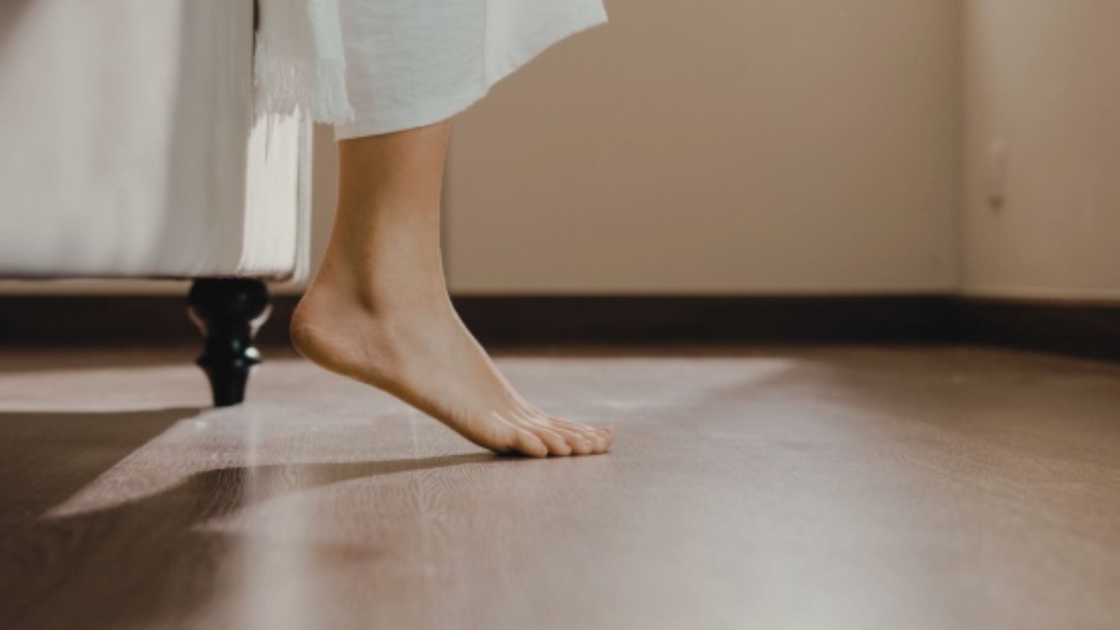person trying to walk on fully cured hardwood floors.