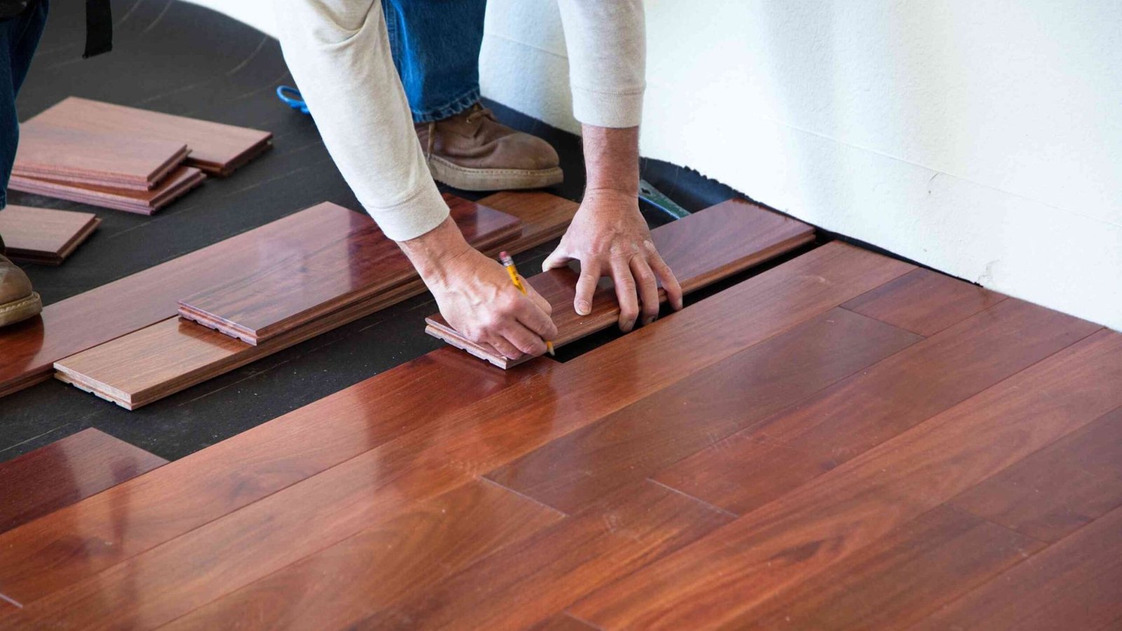 Flooring installer measuring stairs for renovation costs