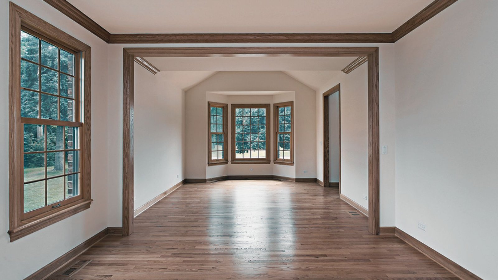 Modern living room with stylish painted hardwood floors on a budget.