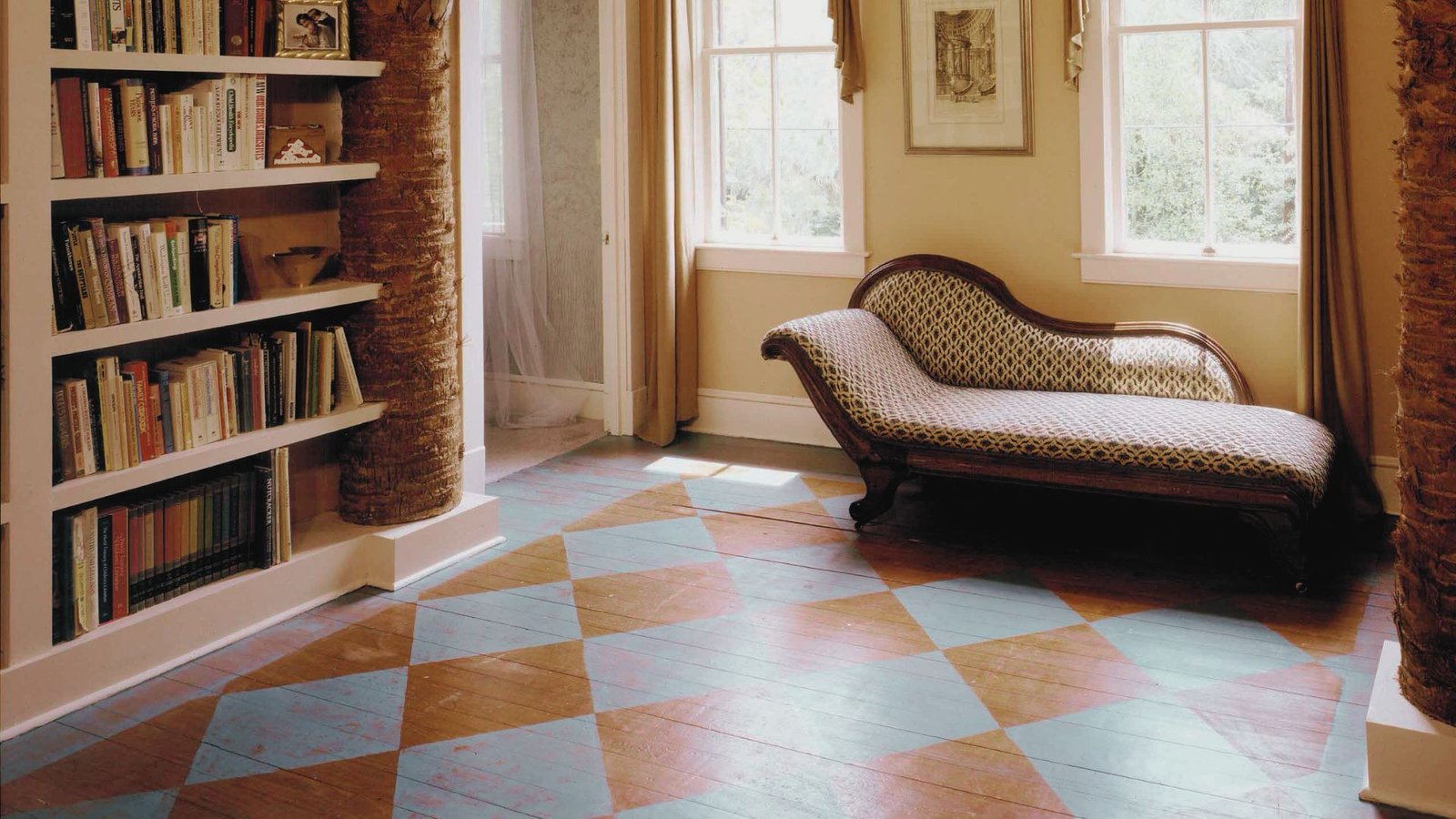 A study room having painted hardwood floors.