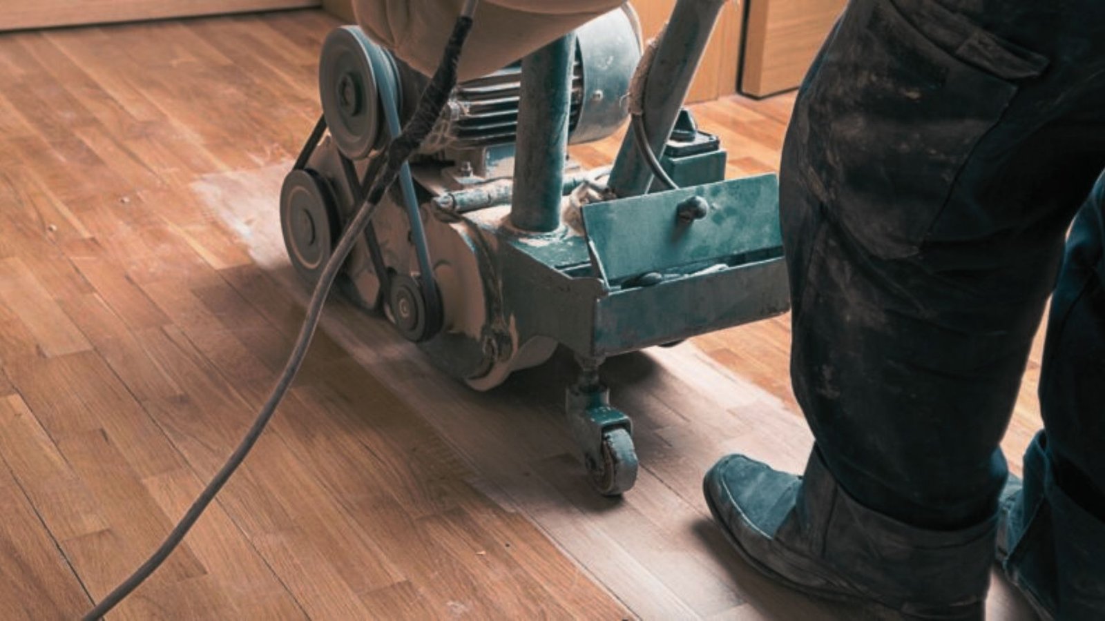 Recoating the hardwood floor.