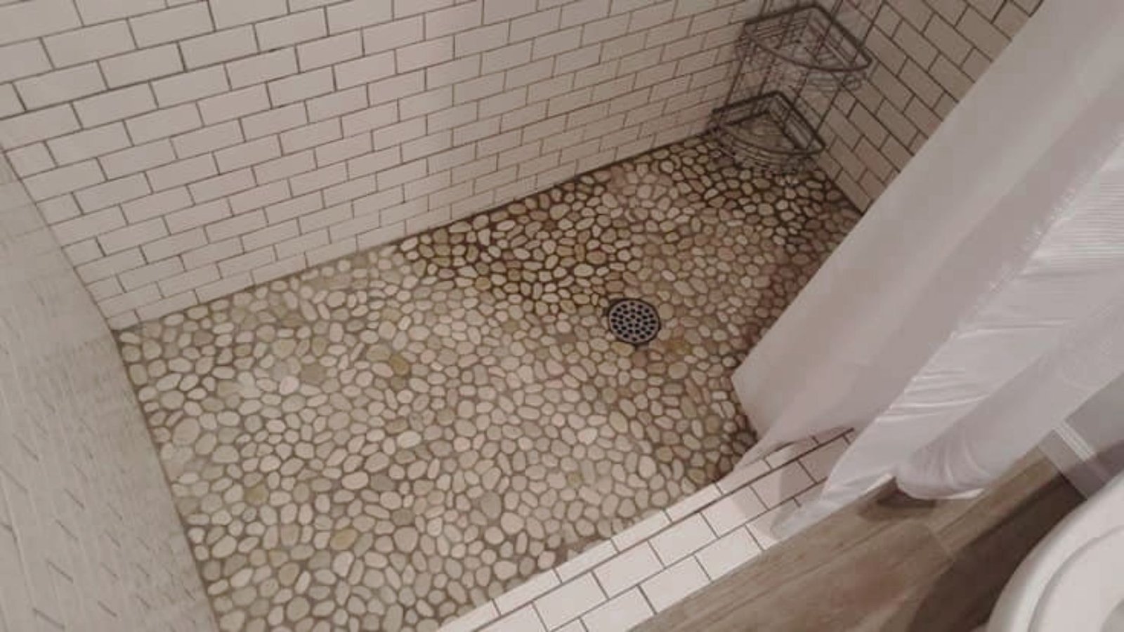 Image showing bathroom river rock shower floor.