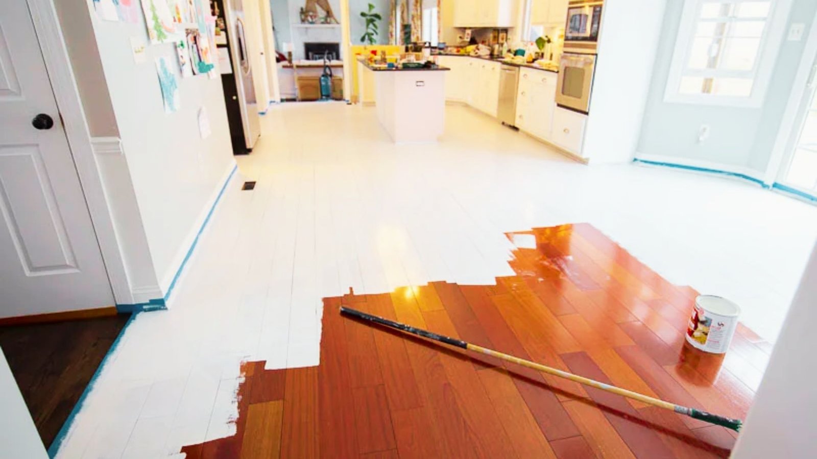 Picture showing painting the hardwood floor.