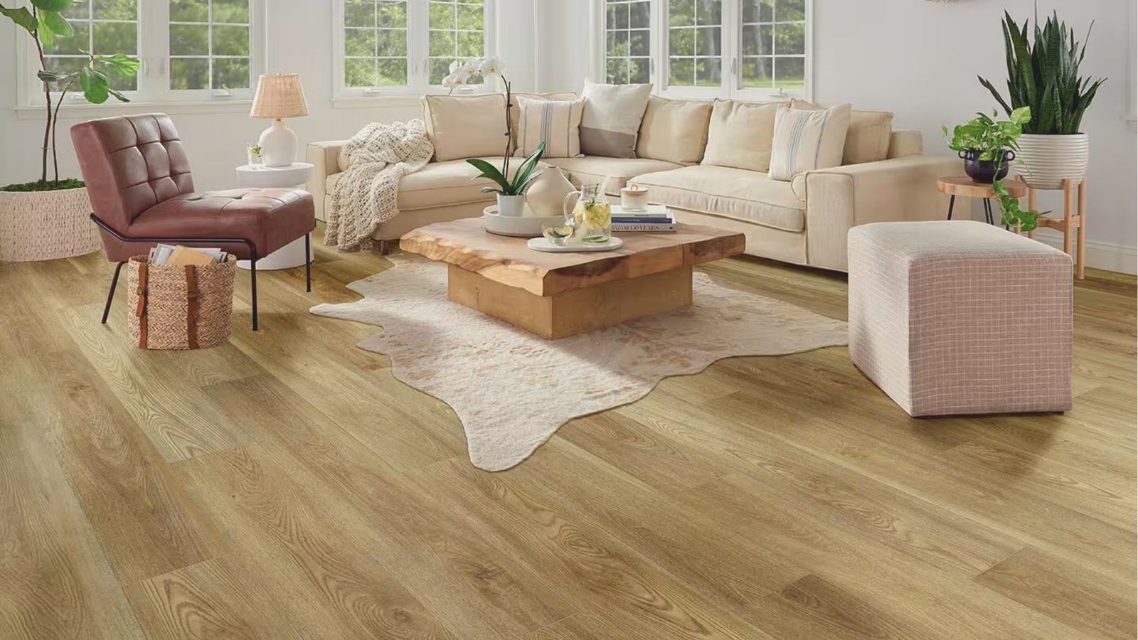 A cozy living room featuring wood floors and a white couch, creating a warm and inviting home atmosphere.